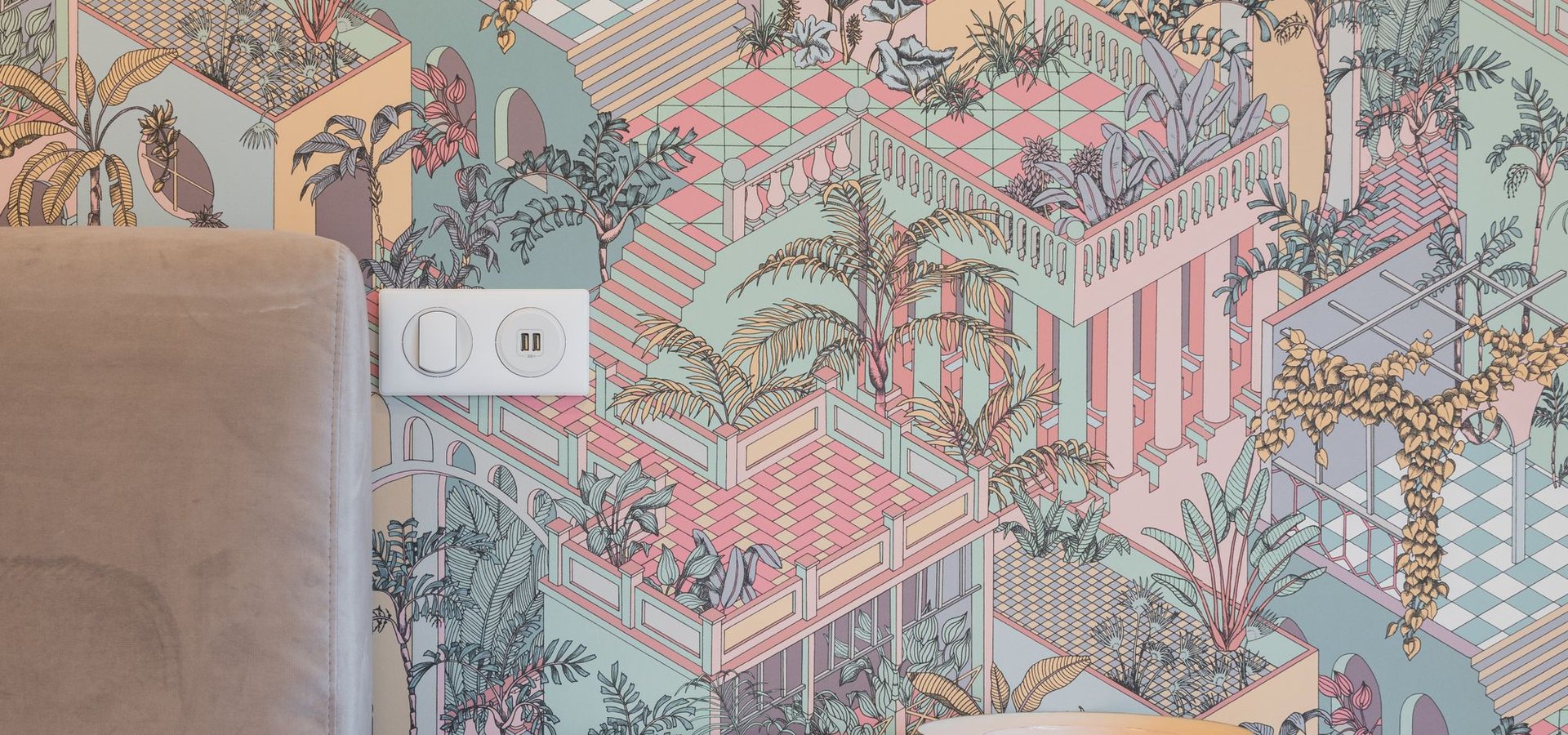 Wall with a soft scenic wallpaper in a bright interior
